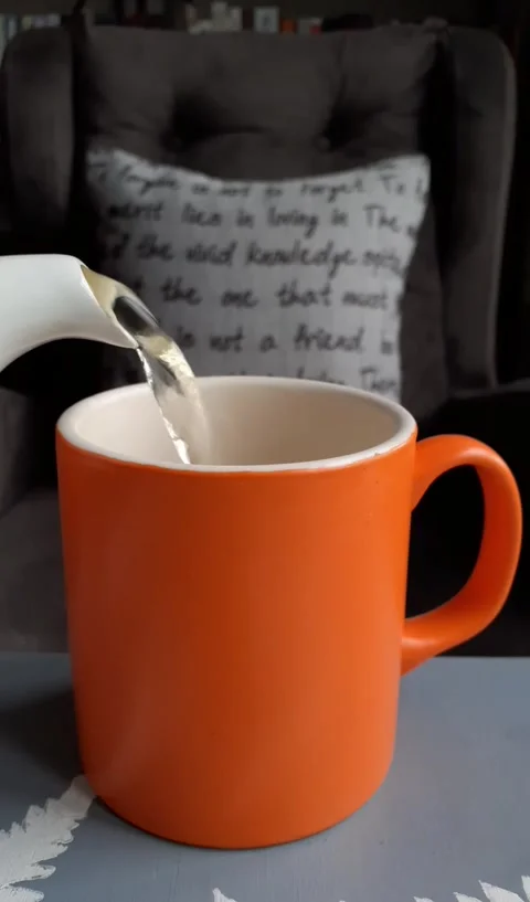 Argon Tableware Orange Mug with Glossy White Interior Vídeos de archivo 339267536