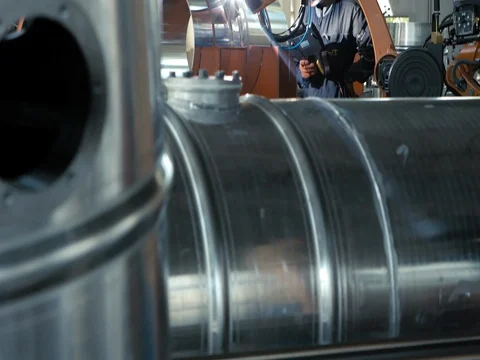 ARGON WELDING. A blacksmith or welder, with his welder, welding steel and iron Stock Footage 77928170