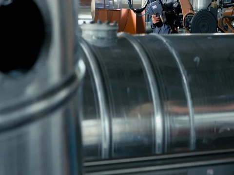 ARGON WELDING. A blacksmith or welder, with his welder, welding steel and iron Stock Footage 77944175