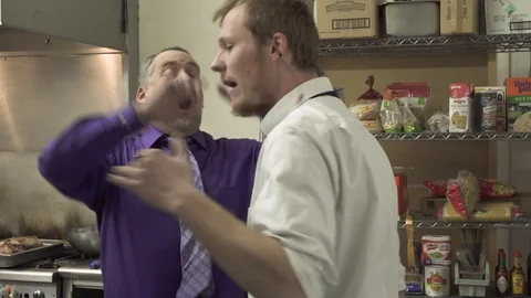 Argument between Angry Restaurant Manager and Grunge Waiter Stock Footage 124873374