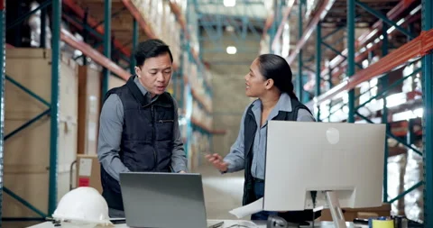 Argument, computer and documents with people in warehouse for disagreement or Stock Footage 335895850