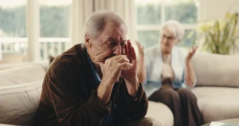 Argument, upset and senior man on sofa in home with fighting, disagreement or Stock Footage 342235096