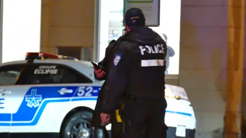 Argumentation between masked man and police officer Stock Footage 138651857