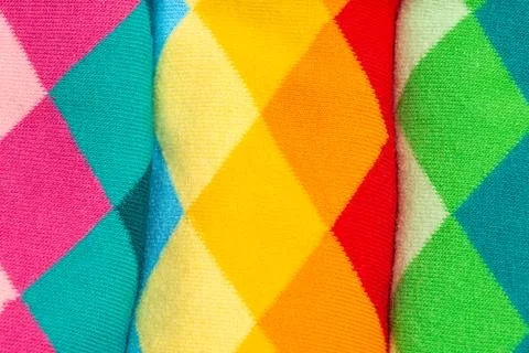Argyle pattern on colorful socks. Diamond-shaped textiles as background Stock Photos