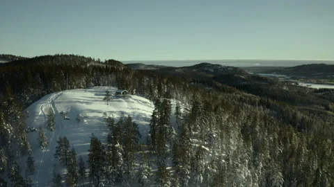 Arial of a cabin on a snowy top 動画素材 166146144