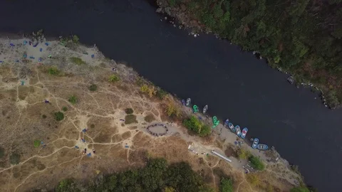 Arial of a camp sight near a river bank Stock Footage 103736108