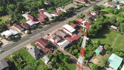 Arial counter-clockwise circle tilted down of a Celphone-tower Stock Footage 155947714