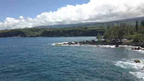 Arial drone flight over ocean rocks Hawaii Video stock 166637673