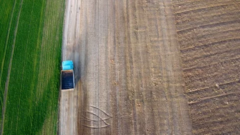 Arial drone footage: Post soviet era truck riding agricultural field Stock Footage 121564904