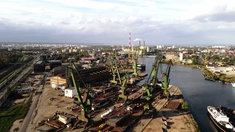 Arial drone industrial ship crane in city port waiting for commercial boat wi Stock Footage 220803963