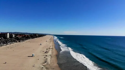 Arial drone view of beach with waves and horizon. Stock Footage