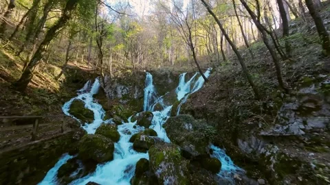 Arial footage of a small stream with multiple waterfalls 스톡 동영상 243372612