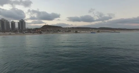 Arial forward over calm sea and fishing boat Video stock 82401626