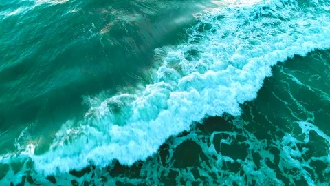 Arial of ocean waves to sunrise Stock Footage 104512513