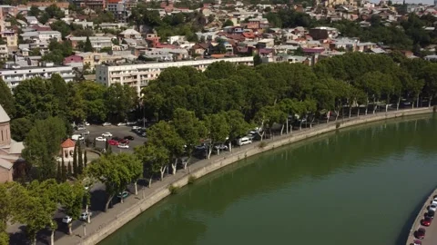 Arial pan shot of Tbilisi river, Georgia Stockbeeldmateriaal 248871225