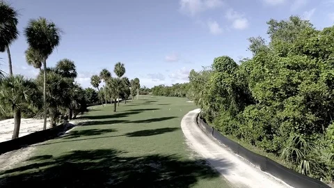 Arial of par 4 golf course fairway Stock Footage 103284272