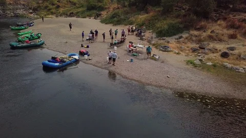 Arial of people next to a river Stock Footage 103813635