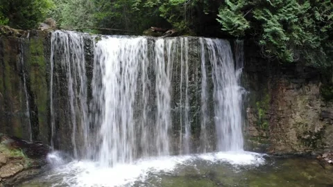 Arial Pull Out Of Small Waterfall Stock Footage 141156898