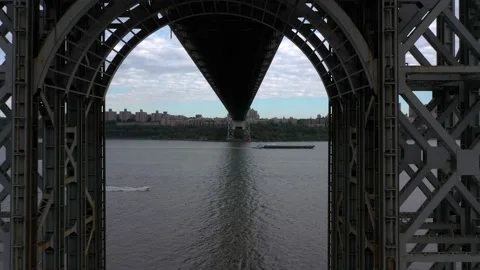 Arial Shot of Boat Going Under Bridge on the Manhattan Bridge (4K) Stock Footage 145384569
