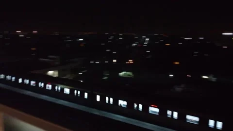 Arial shot of orange train at night at Lahore with city view Stock Footage 199269597