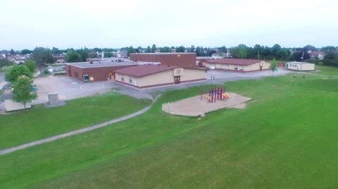 Arial Shot Over Elementary School and Suburbs Stock Footage 66288552