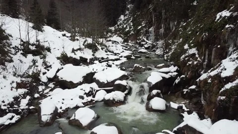 Arial shot over snowy river in the north of turkey Stock Footage 161077220