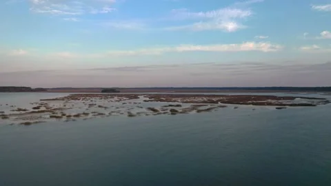 Arial shot over some islands with a beautiful skyline. Stock Footage 153801008
