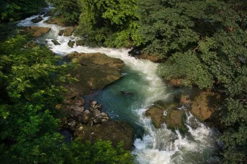 Arial shot of river with waterfall Stock Photos