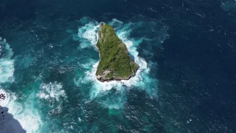 Arial shot of rock in the blue ocean near Banah Cliff 動画素材 247298048