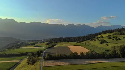 Arial Shot Tirol Mountains fields sunny summer day Stock Footage 92615324