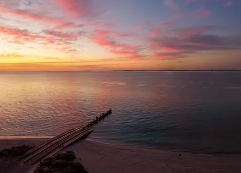 Arial sunset at Long Point Jetty with people fishing and swimming, Port Kenne Foto stock