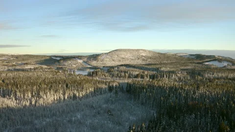 Arial towards a snowy mountain 動画素材 166154994