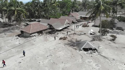 Arial view of BROKEN HOUSE BECAUSE OF COLD LAVA IN RENTENG VILLAGE, LUMAJANG. Stock Footage 166811454