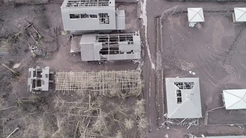 ARIAL VIEW OF BROKEN HOUSE IN CURAH KOBOKAN VILLAGE, LUMAJANG. SEMERU ERUPTION Stock Footage 166803241