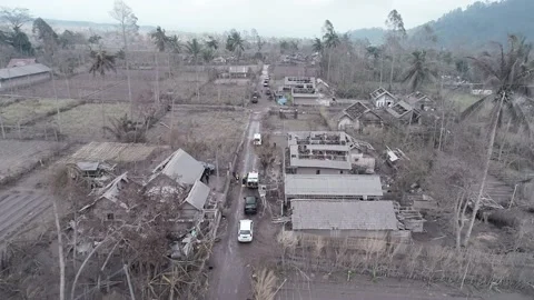 ARIAL VIEW OF BROKEN HOUSE IN CURAH KOBOKAN BECAUSE OF SEMERU ERUPTION Stock Footage 166805713