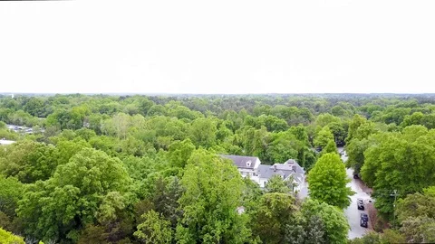 Arial View of Building Among Trees Stock Footage 99517590