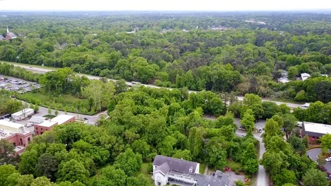 Arial View of Building Among Trees Stock Footage 99517696