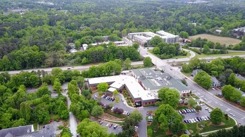 Arial View of Building Among Trees Stock Footage 99517959