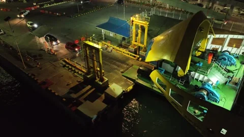 ARIAL VIEW  OF CARS GOING INSIDE OF SHIP AT MERAK PORT, BANTEN, INDONESIA Stock Footage 239379864