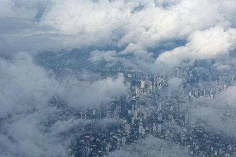 Arial view of cloudscape and a city Stock Photos