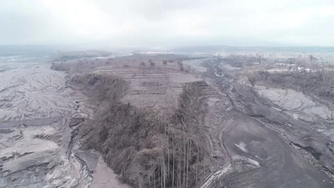 ARIAL VIEW OF COLD LAVA STREAM AT CURAH KOBOKAN VILLAGE, LUMAJANG Stock Footage 166802622