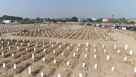 ARIAL VIEW OF COVID 19 CEMENTERY AT ROROTAN JAKARTA, INDONESIA. Video stock 157389642