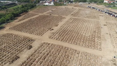 ARIAL VIEW OF COVID 19 CEMENTERY AT ROROTAN JAKARTA, INDONESIA. Stock Footage 157389691