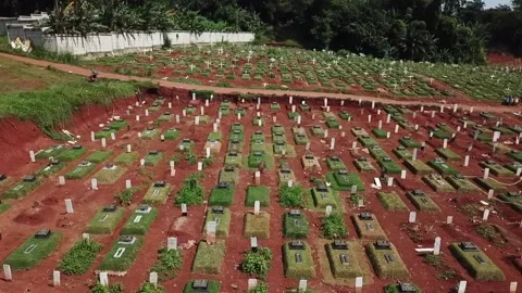 ARIAL VIEW OF COVID 19 CEMENTERY AT BAMBU APUS JAKARTA, INDONESIA. Video stock 165408288