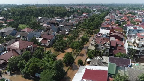 ARIAL VIEW OF FLOOD AT BUMI NASIO INDAH HOUSING AREA AT TANGERANG, INDONESIA Stock Footage 164528595