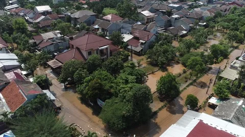 ARIAL VIEW OF FLOOD AT BUMI NASIO INDAH HOUSING AREA AT TANGERANG, INDONESIA Video stock 164528616