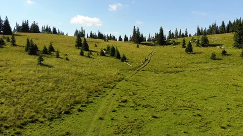 Arial view of the mountain Vranica and people walking in the distance Stock Footage 129288535