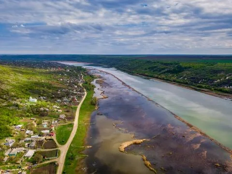 Arial view over the river and small village. Stock Photos