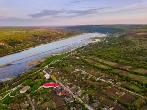 Arial view over the river and small village. Stock-Fotos