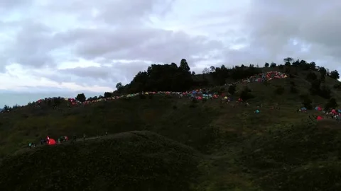ARIAL VIEW PEOPLE CAMP AT THE TOP OF MOUNTAIN Stock Footage 134966723